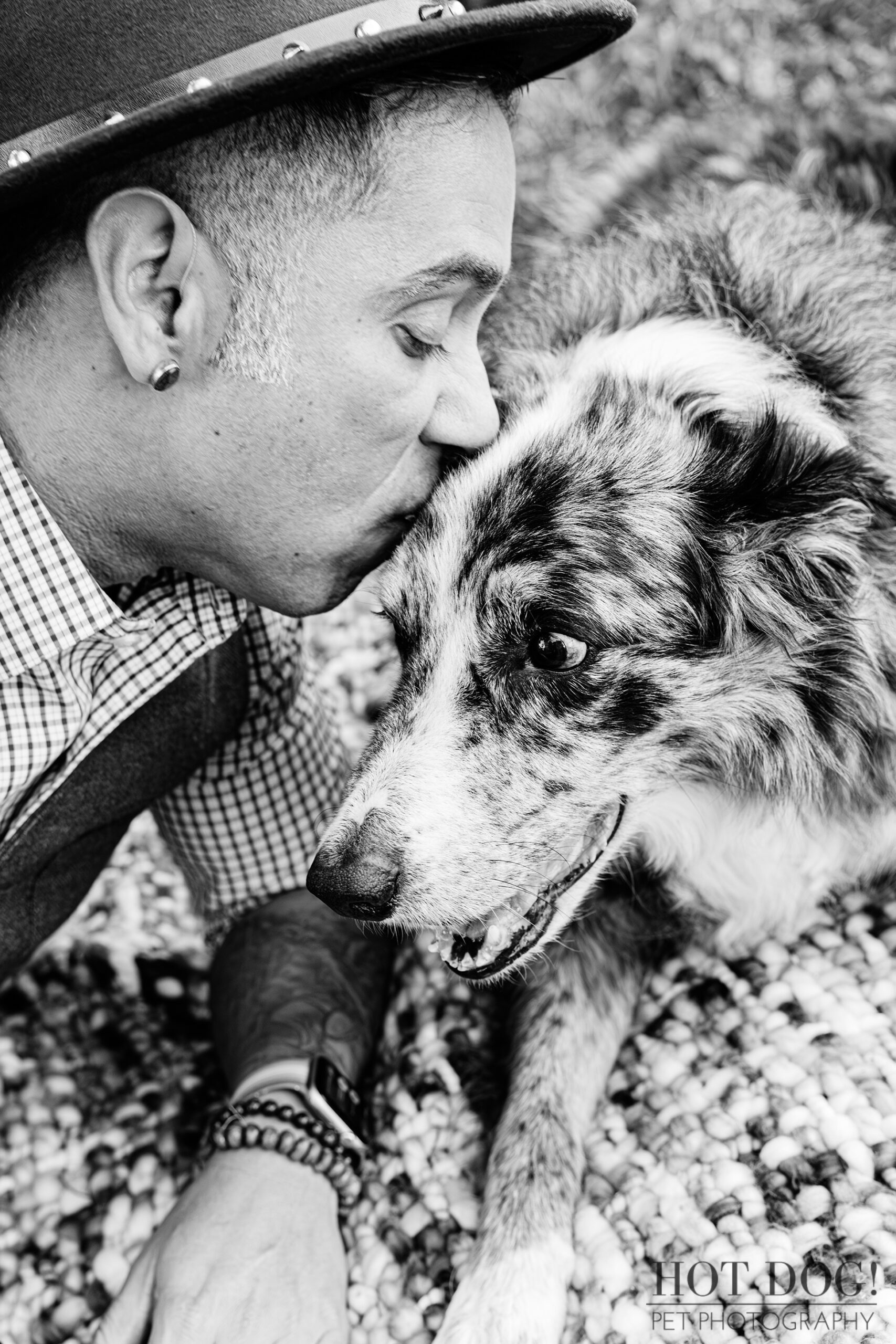 A beautiful black and white photo of Andres giving Flash a gentle kiss on the head.