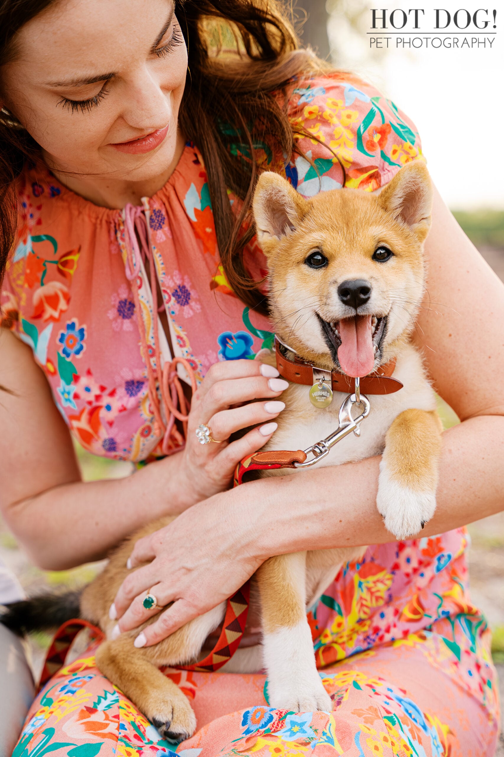 Alyssa cuddling a happy Shiba Inu puppy Auro during his outdoor puppy photography session in Baldwin Park.