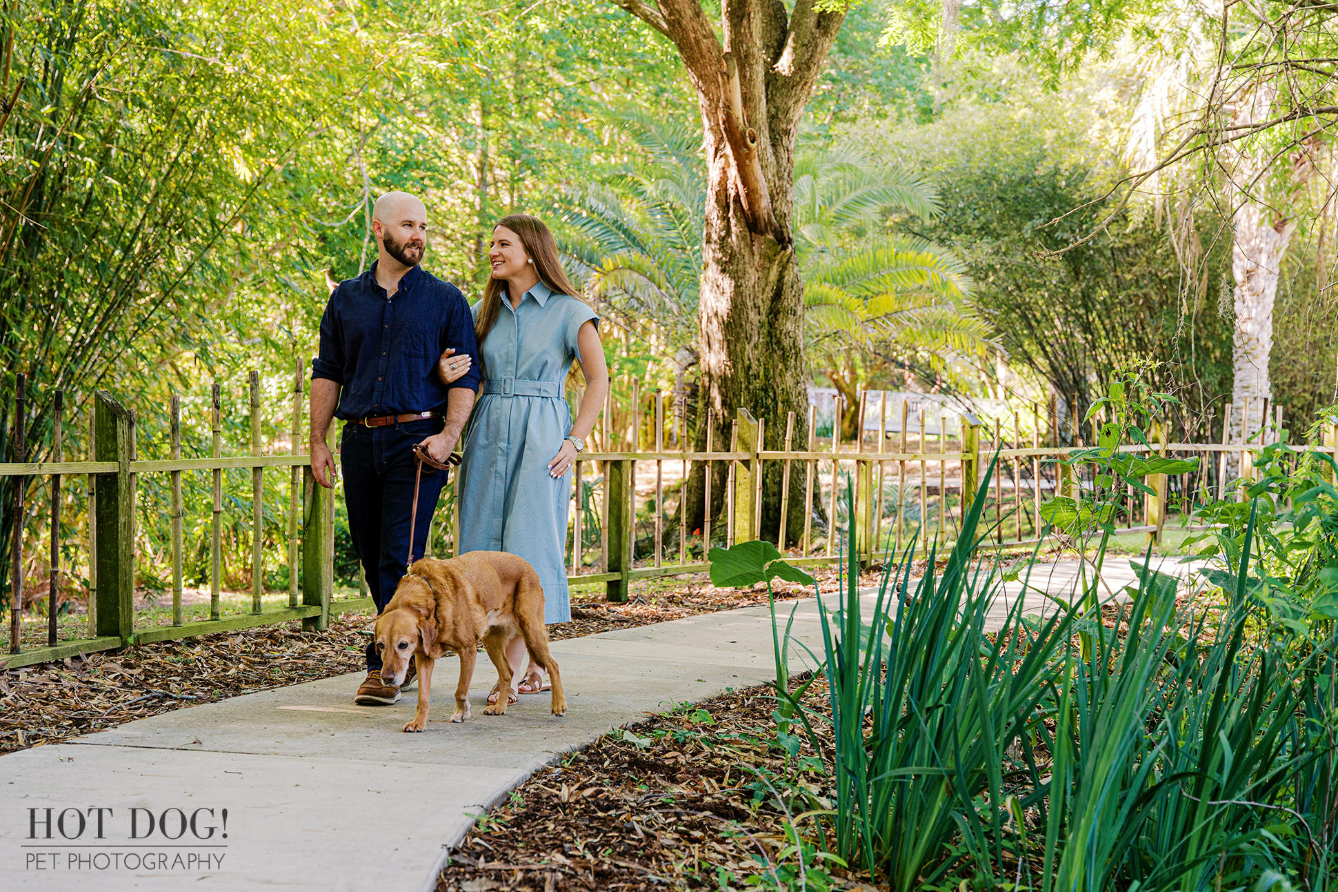 Chloe and Bryson walk with Dixie along a garden path at Kanapaha Botanical Gardens in Gainesville, Florida.