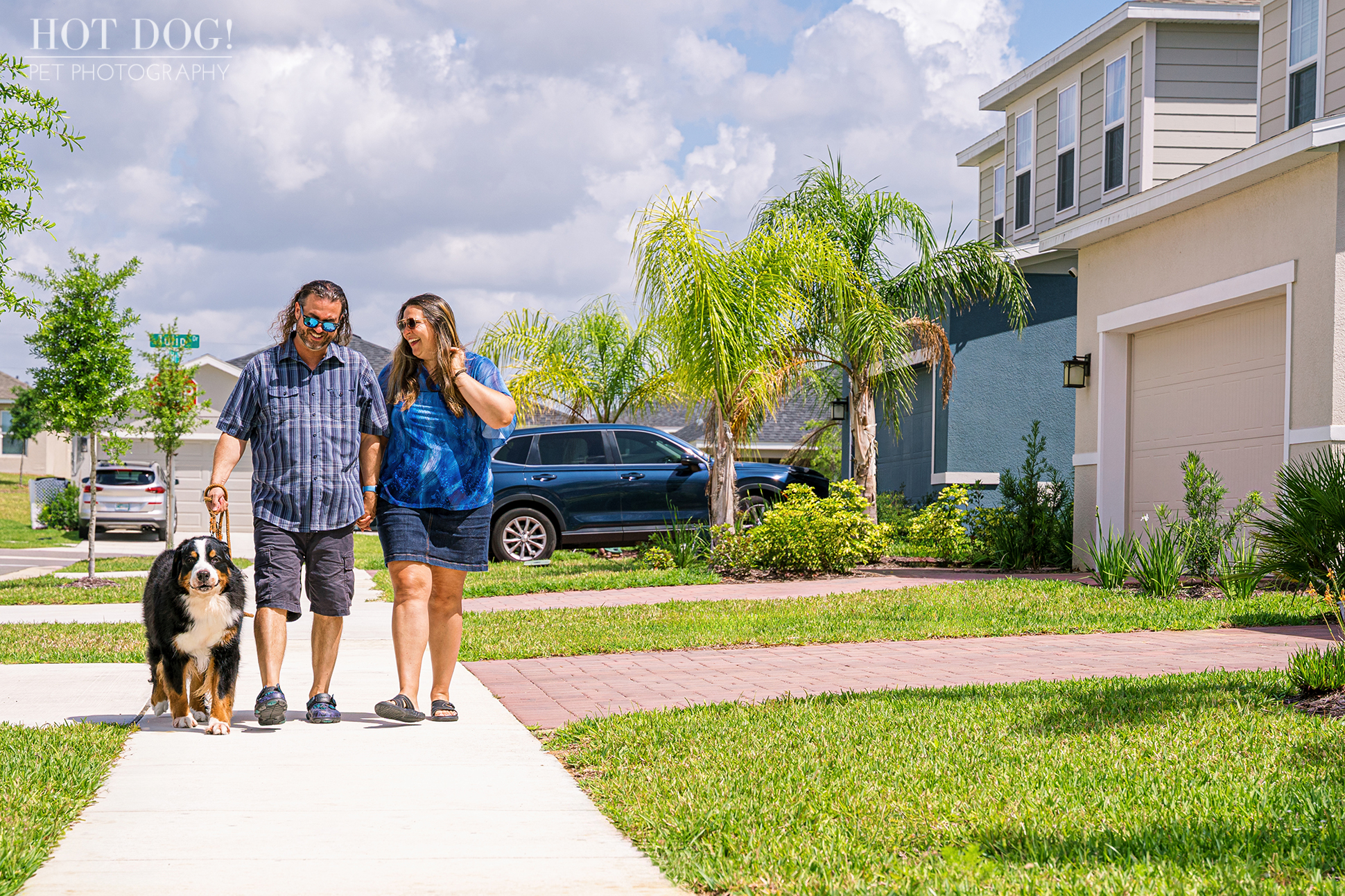 Helen and Jeremy walking Flynn in their Davenport neighborhood.