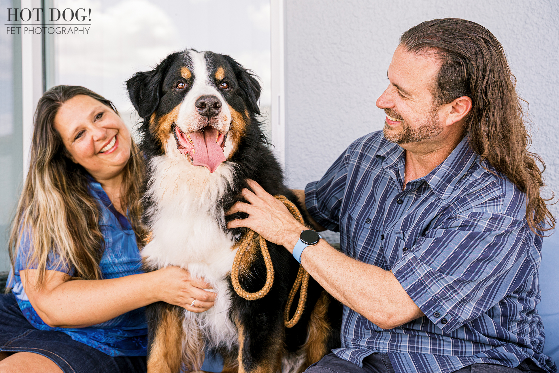 Helen and Jeremy cuddling Flynn and smiling at each other.
