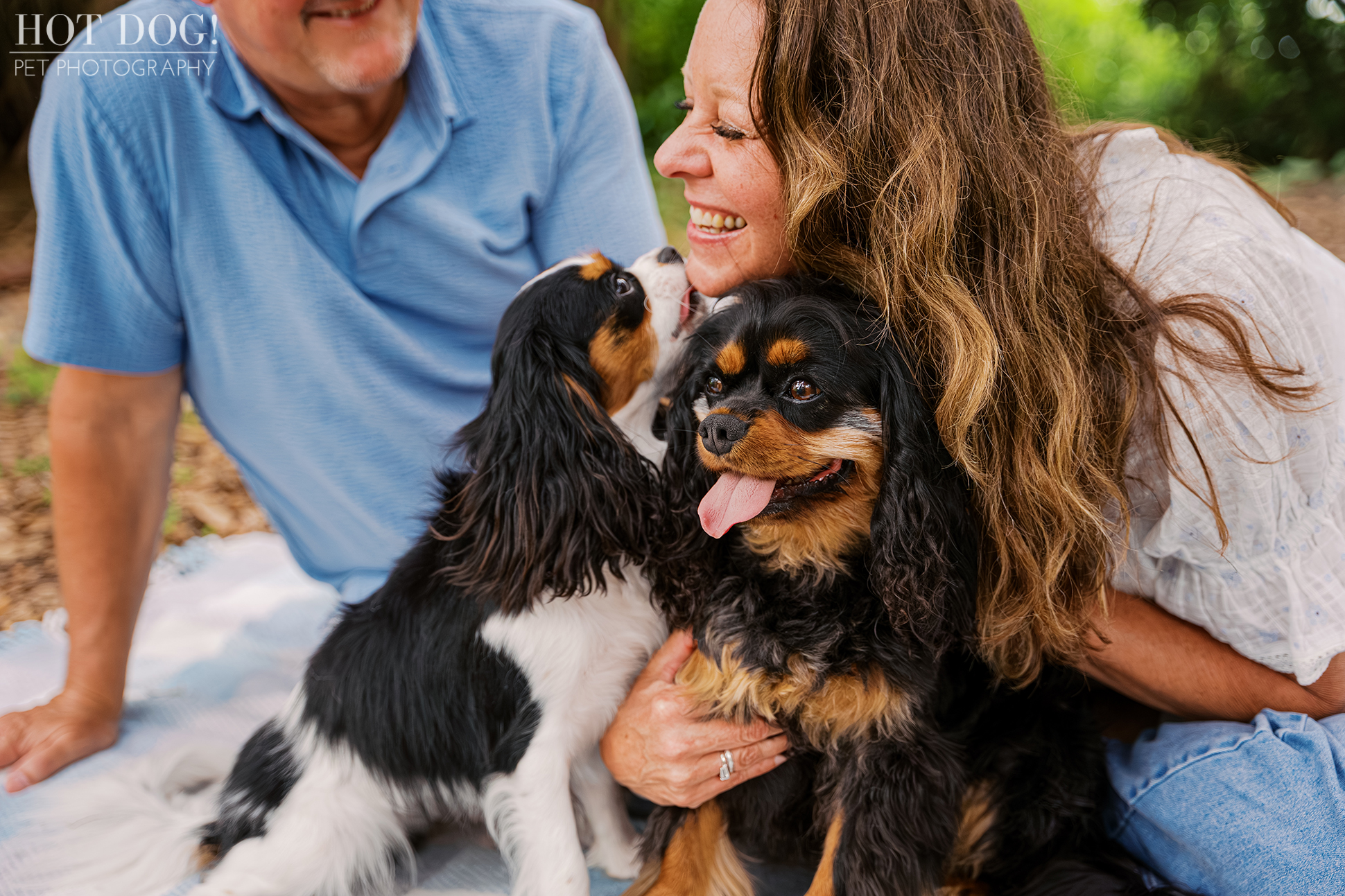 Jerzee giving Tonia a kiss while Jazmyn sits beside them during a playful Central Florida pet photography session.