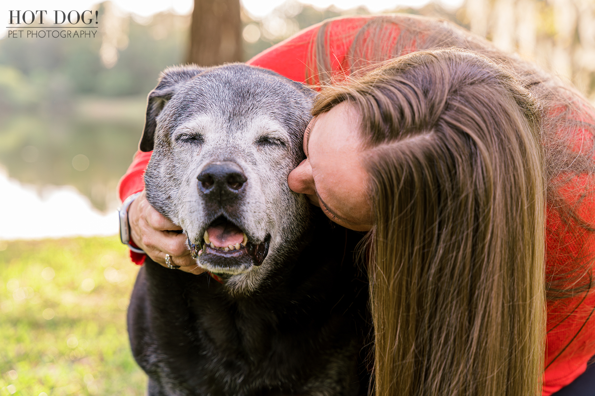 Where's the Mistletoe? Lambeau radiates joy as his mom gives him a kiss on the cheek. (Photo by Hot Dog! Pet Photography)