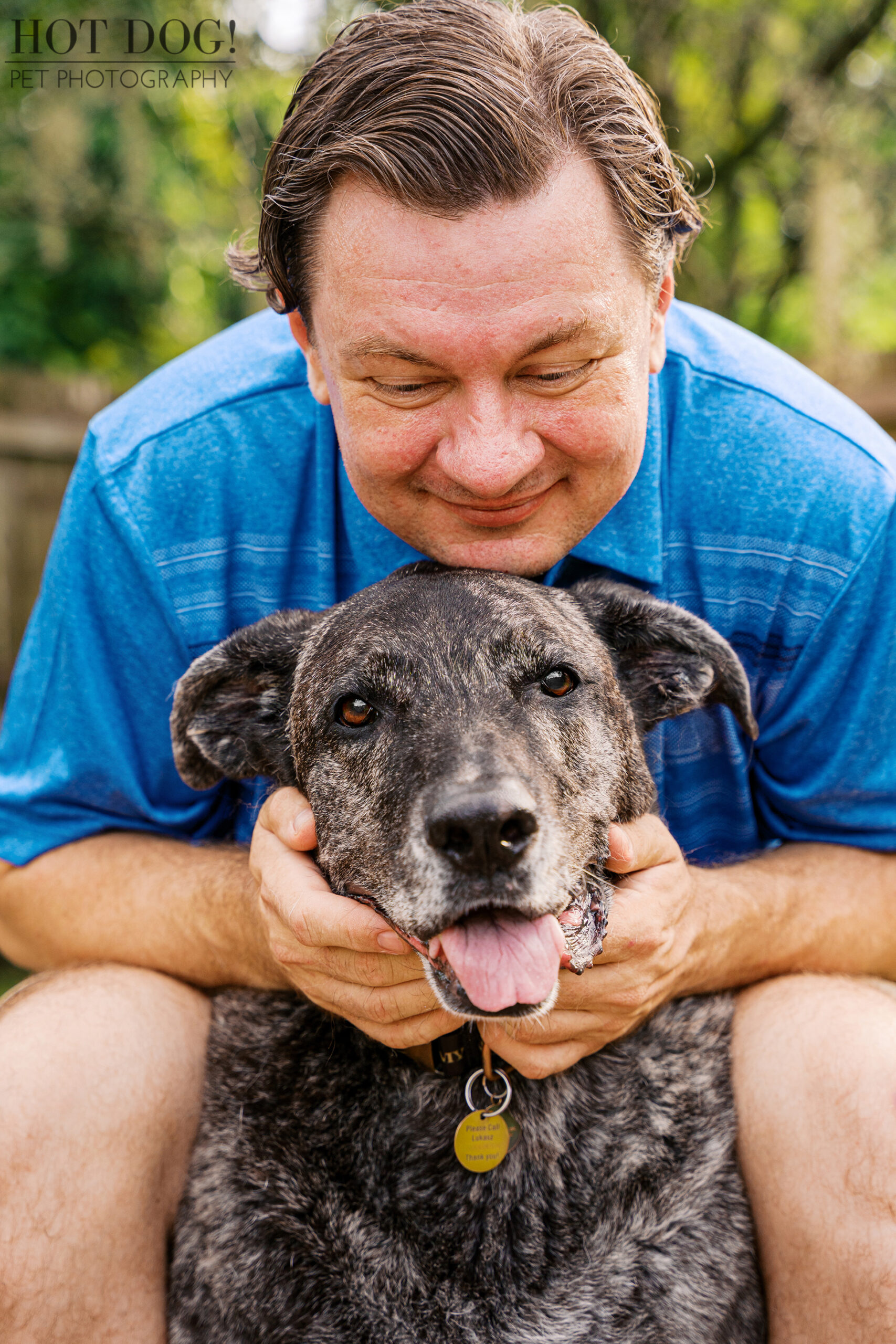Lukasz cuddling Leah closely during their Signature Pet Session.