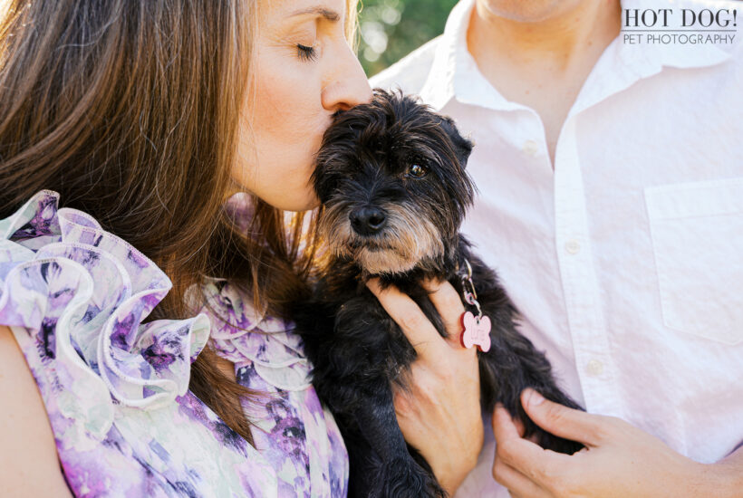 Rae kissing Luna on the head while holding her close.