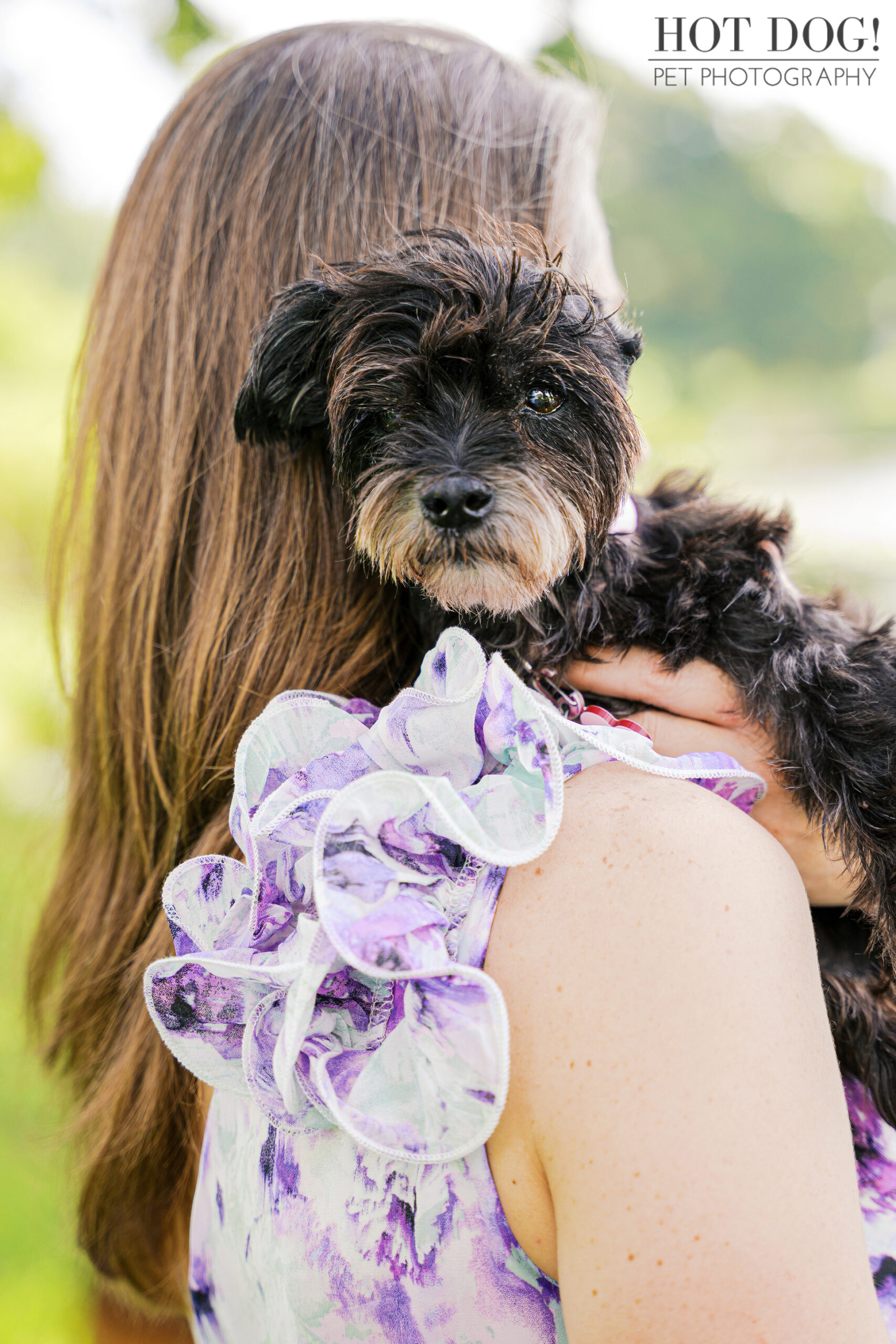 Luna snuggled close to Rae, gazing at the camera.