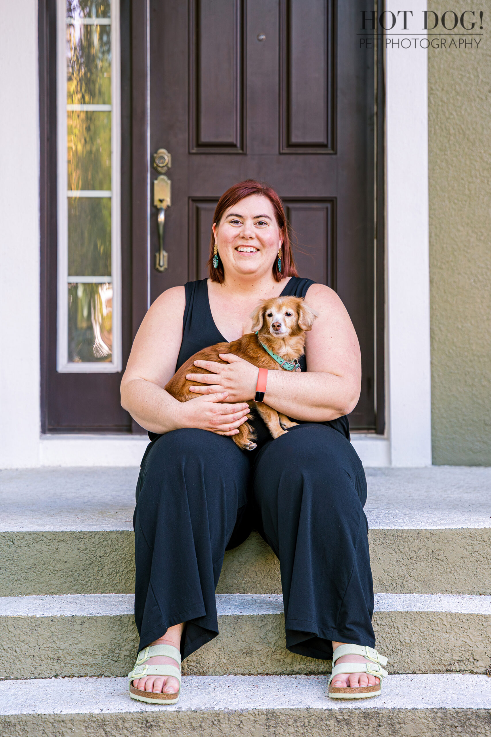 Portrait of Piper being held lovingly by her mom Taya during their Lake Nona pet photo session.
