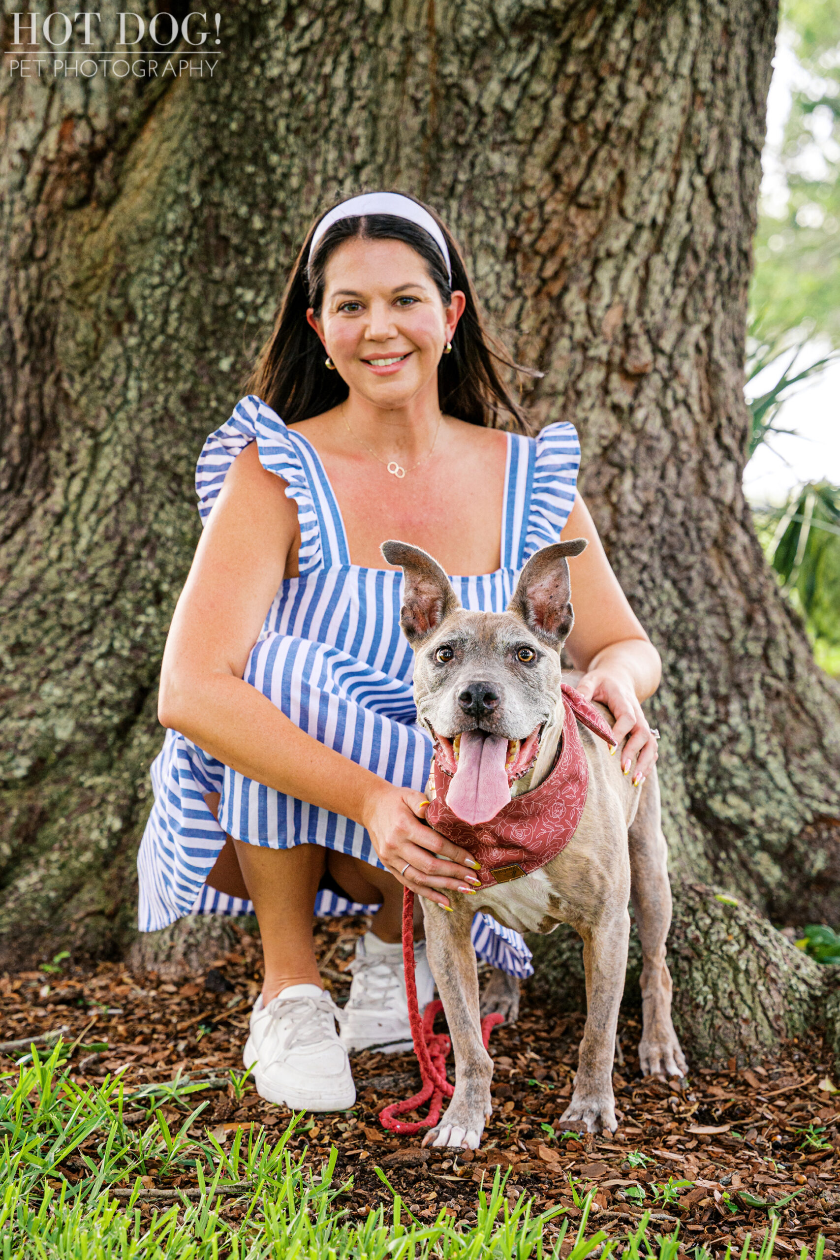Tara kneeling beside Rosie, both smiling during their dog photo session.