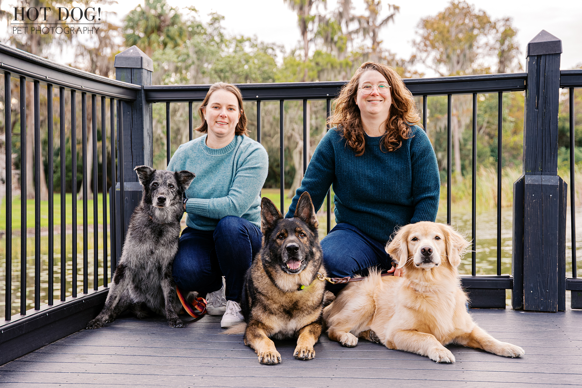 Aimee and Lindsay with Sadie, Appa, and Korra on a dock at Cypress Grove Park in Orlando, Florida.