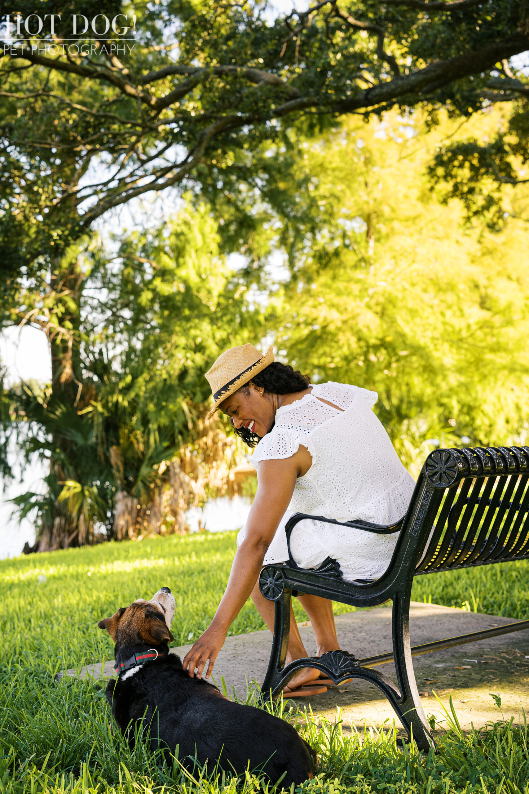 Tripp resting in the grass near Lakeisha’s feet, gazing up at her lovingly.