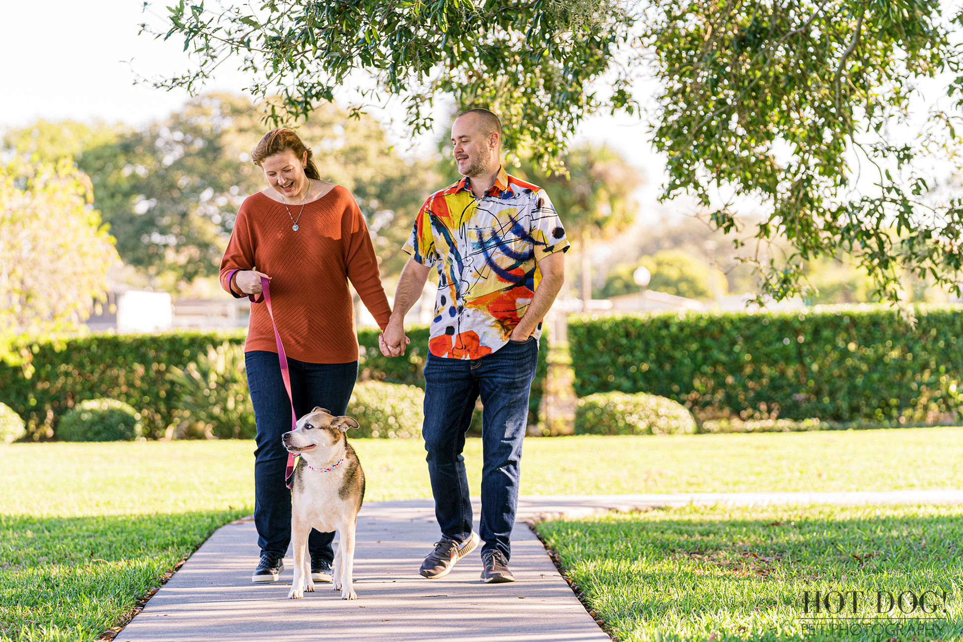 Zoe leads the way as her parents stroll behind her in Newton Park in Winter Garden, Florida. (Photo by Hot Dog! Pet Photography)